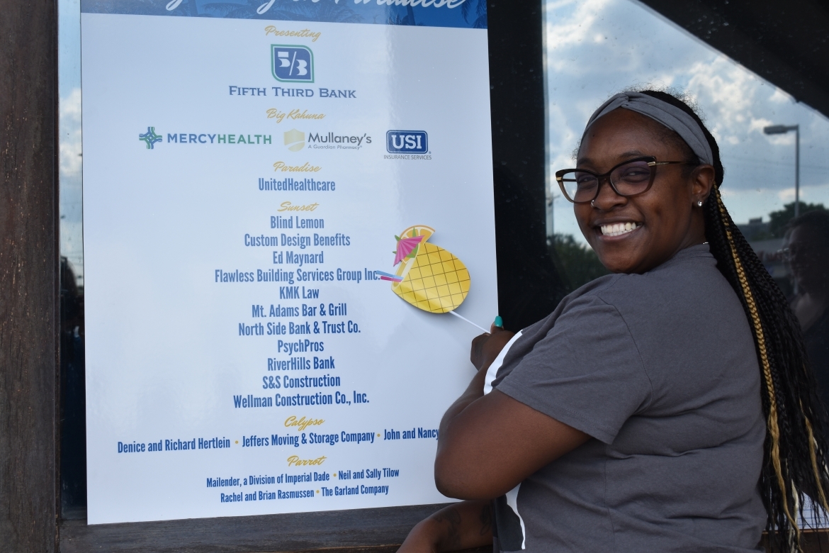 Woman Smiling in front of Fifth Third Sign